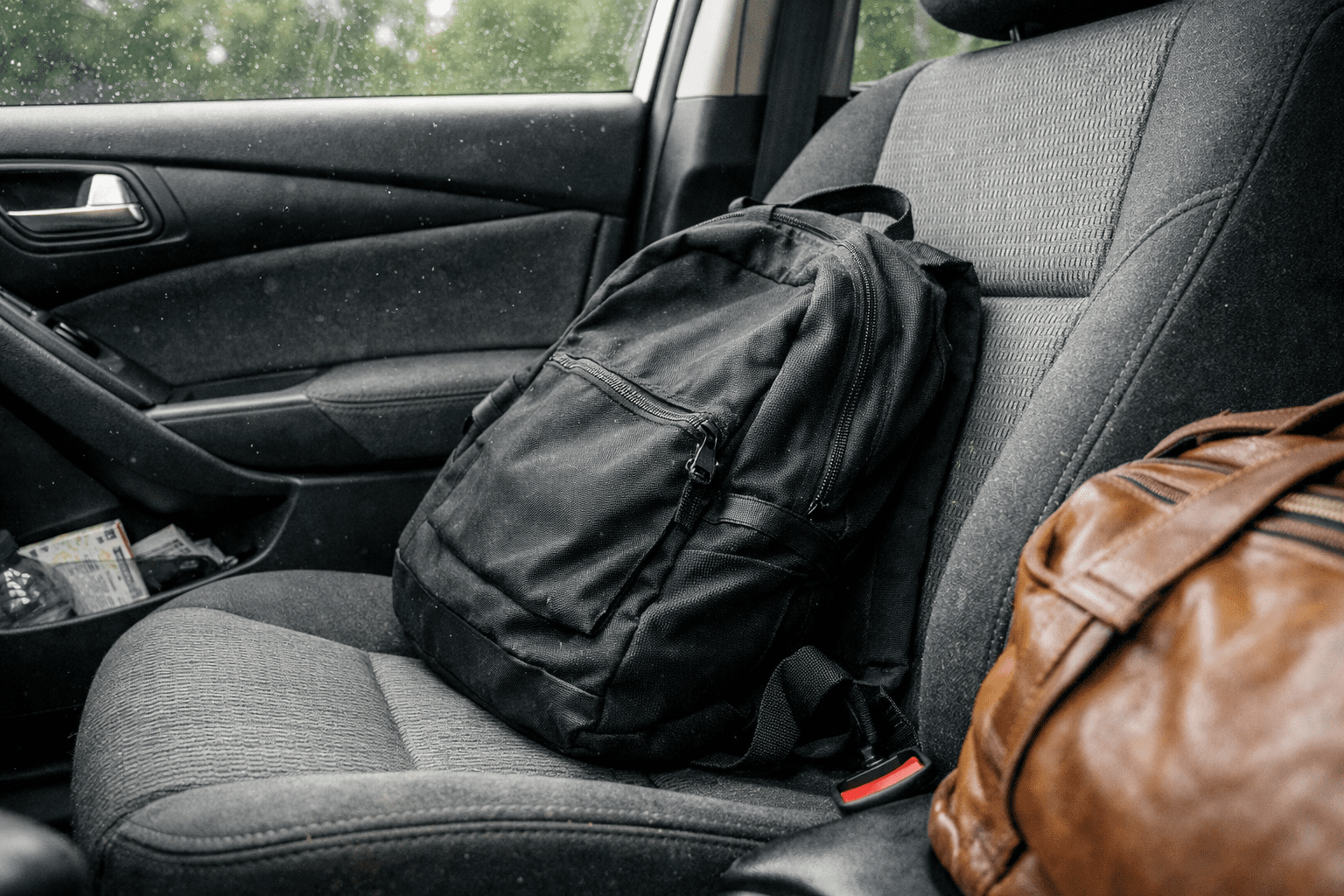 Car interior showing seat seams and crevices where bed bugs hide during vehicle infestations