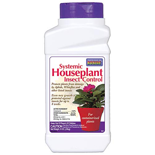 Systemic houseplant insect control granules mixed into potting soil