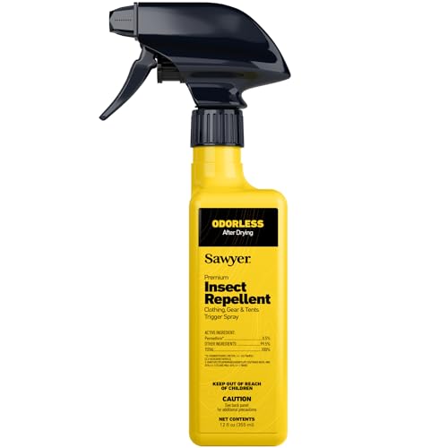 Permethrin clothing spray applied to hiking boots and socks for tick protection